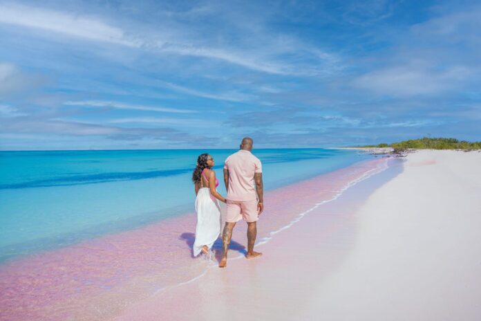 Couple-on-PinkSandBeach-Barbuda-scaled.jpg