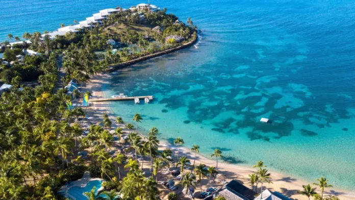 Curtain-Bluff__2018_Curtain-Bluff-Bay-Beach-aerial-e1759676315161.webp