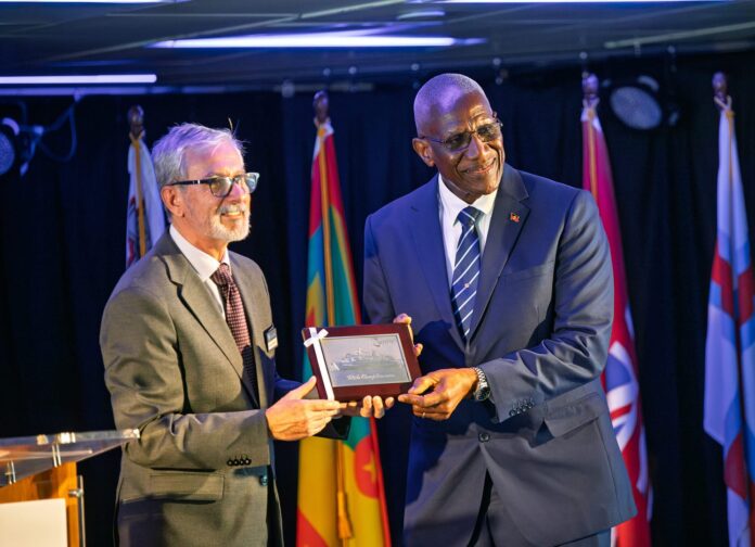 MV-LOGOS-Director-presenting-plaque-to-His-Excellency-The-Governor-General-Sir-Rodney-Williams-scaled.jpg