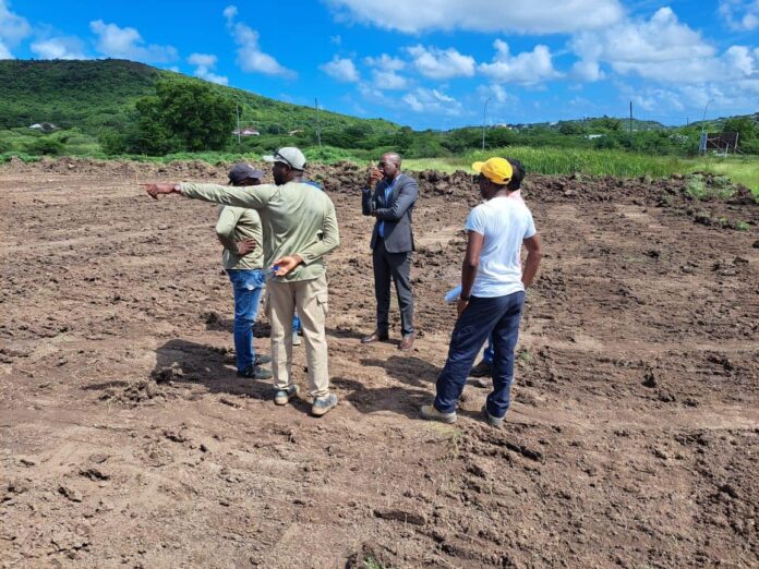 minister-matthew-on-site-of-five-islands-primary-school.jpg